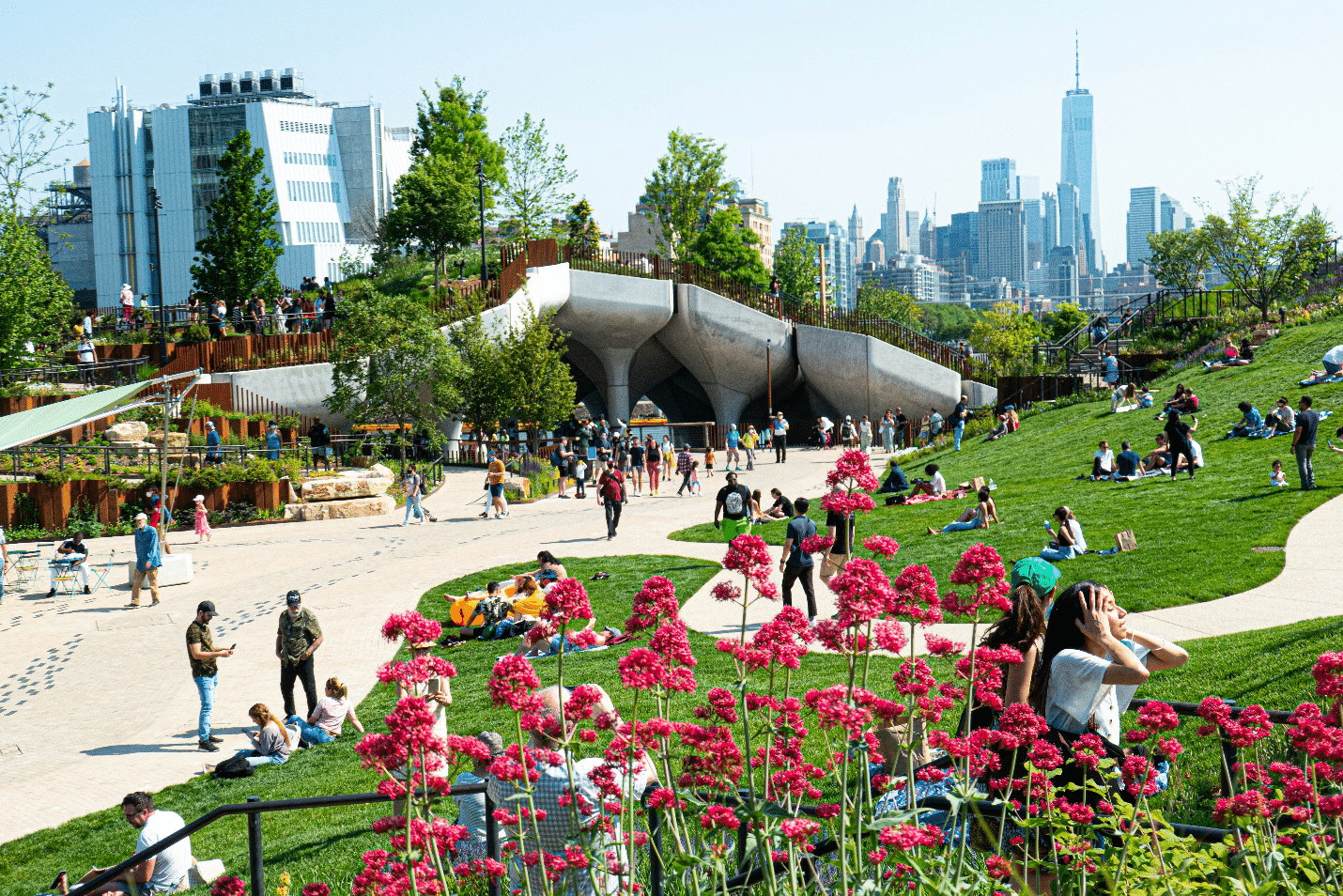 A park with many flowers and people seen during a small group tour in New York City