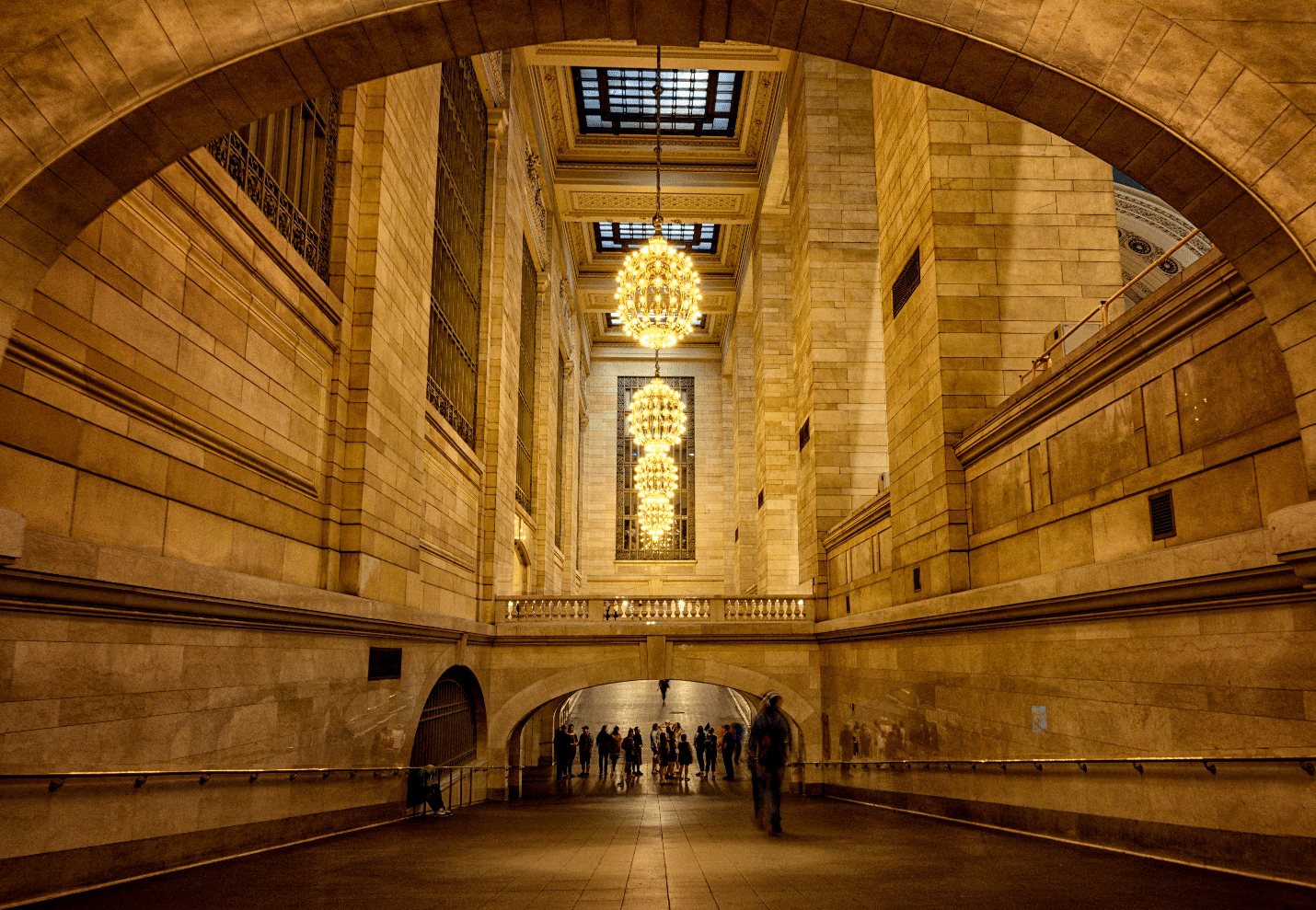 People standing in a large hall during a small group tour in New York City