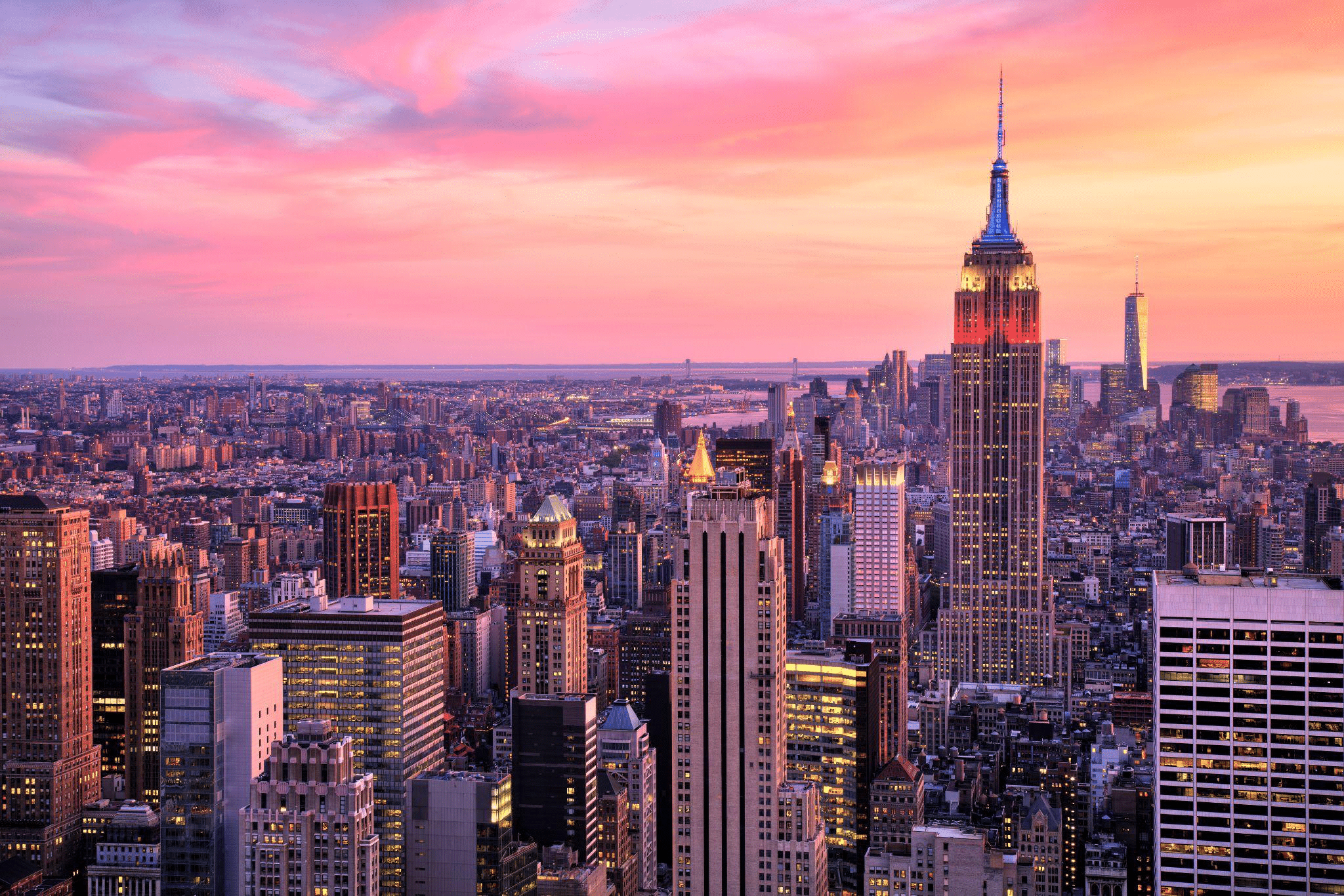 New York City skyline with the Empire State Building at sunset.