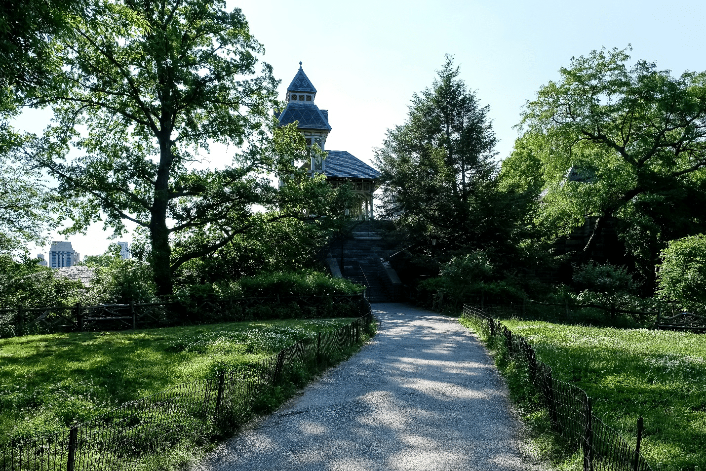 A garden path leading up to a castle during a New York City travel guide