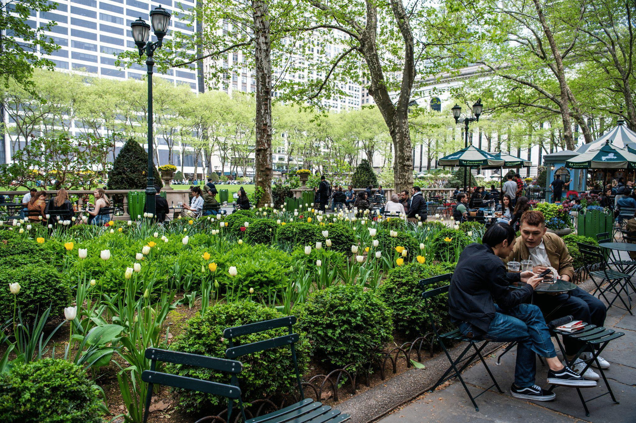 People relaxing in Bryant Park, New York City.