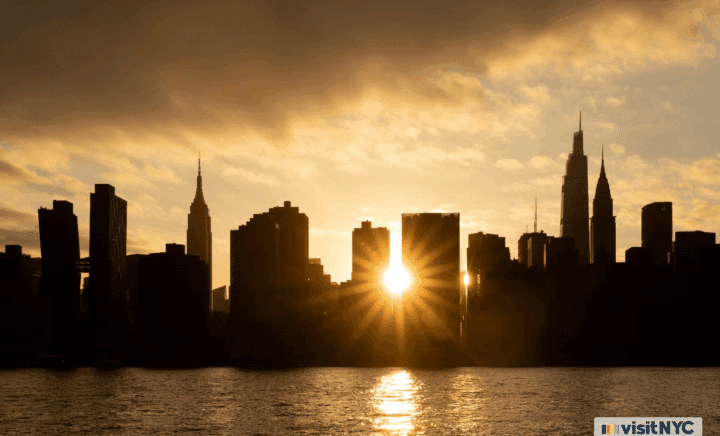 The sun shining from between buildings
