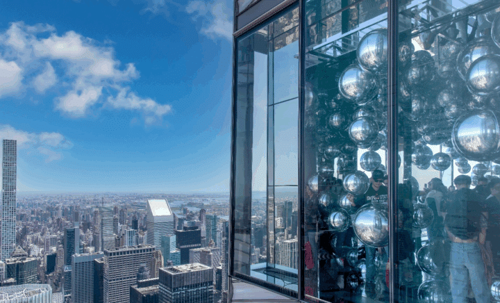 Balloons and people seen through the windows of Summit Vanderbilt