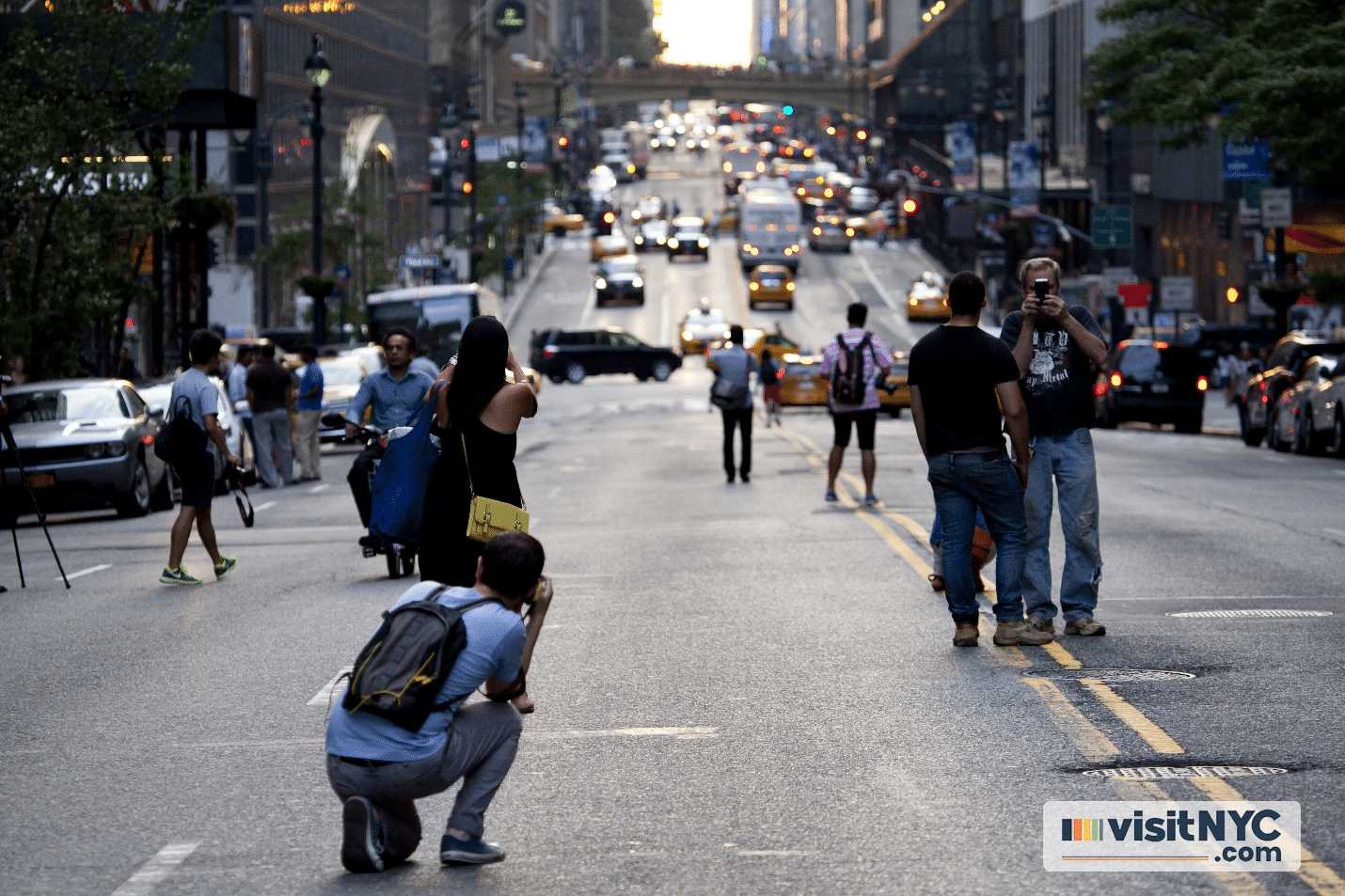 Photographers lined up on a street