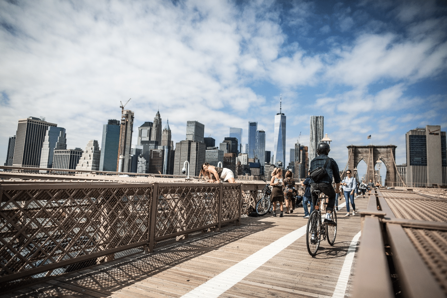 A person biking on Brooklyn Bridge