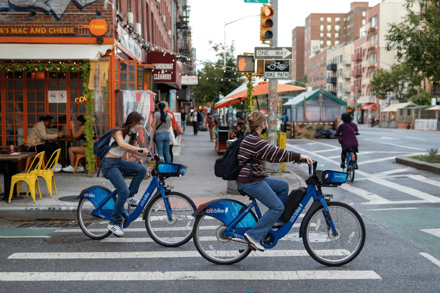 People riding blue Citi Bikes