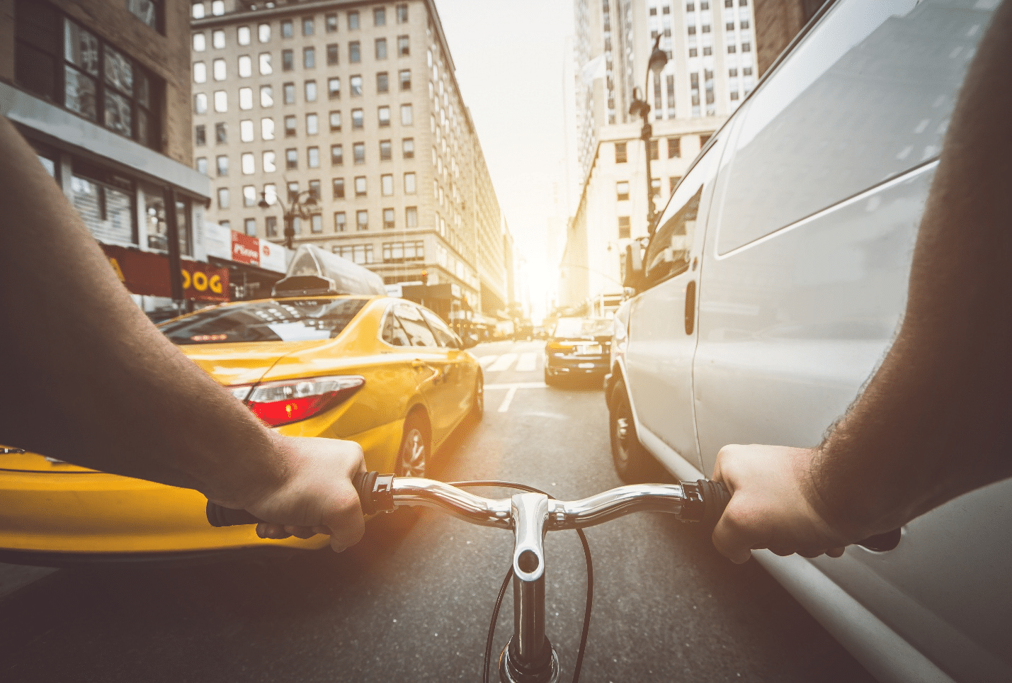 A person biking through traffic