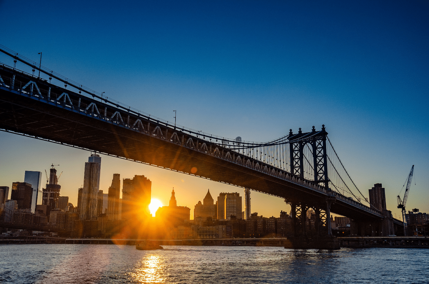 Manhattan Bridge with the sun setting in the back