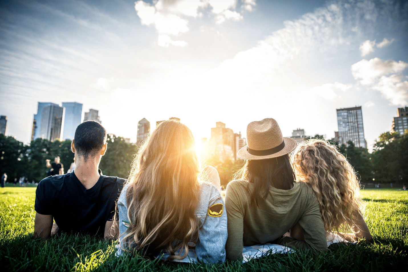 A group of friends lying in the grass