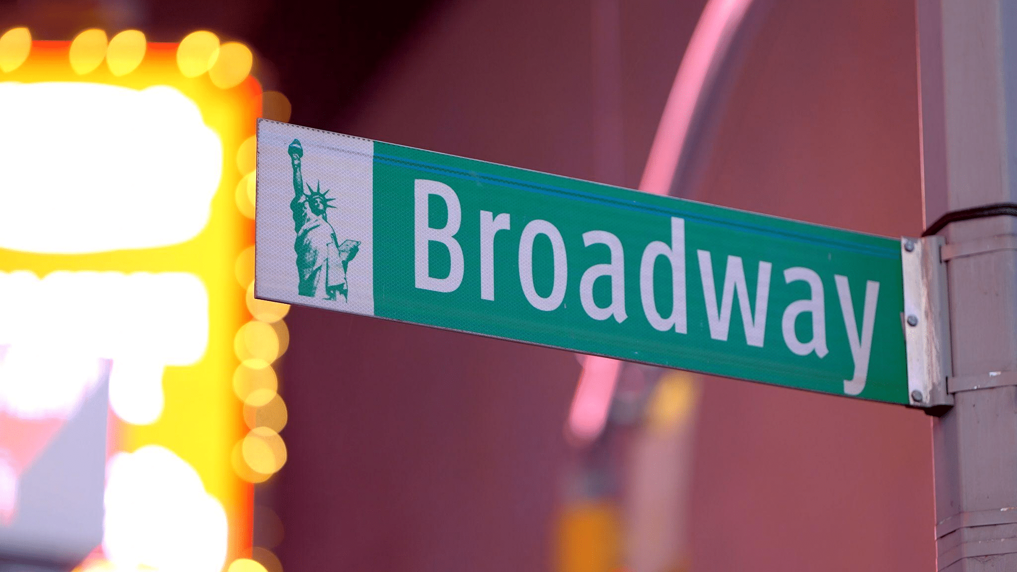 a Broadway street sign