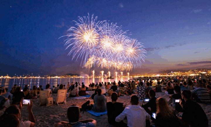 A fireworks show visible from a beach