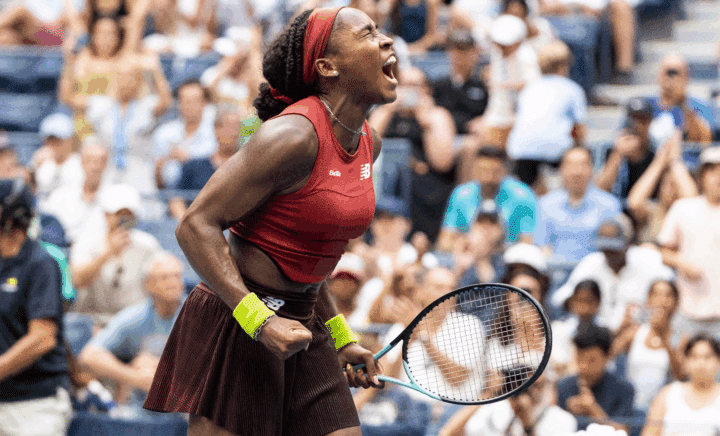 A woman holding a tennis racket