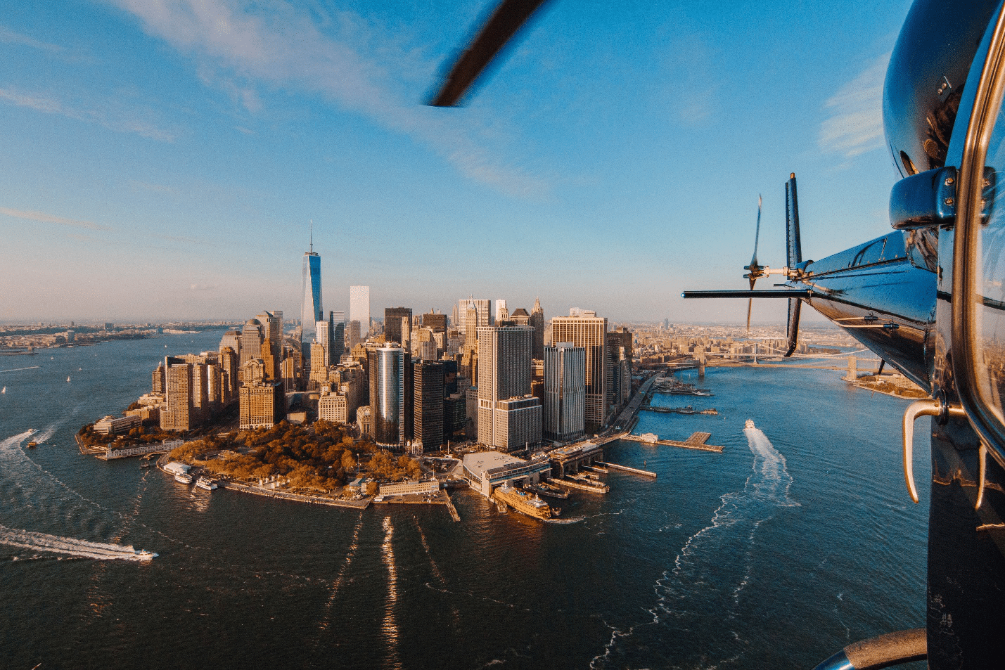 A helicopter tail and NYC behind it