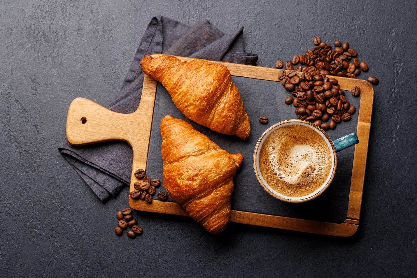 Two croissants and a cup of coffee