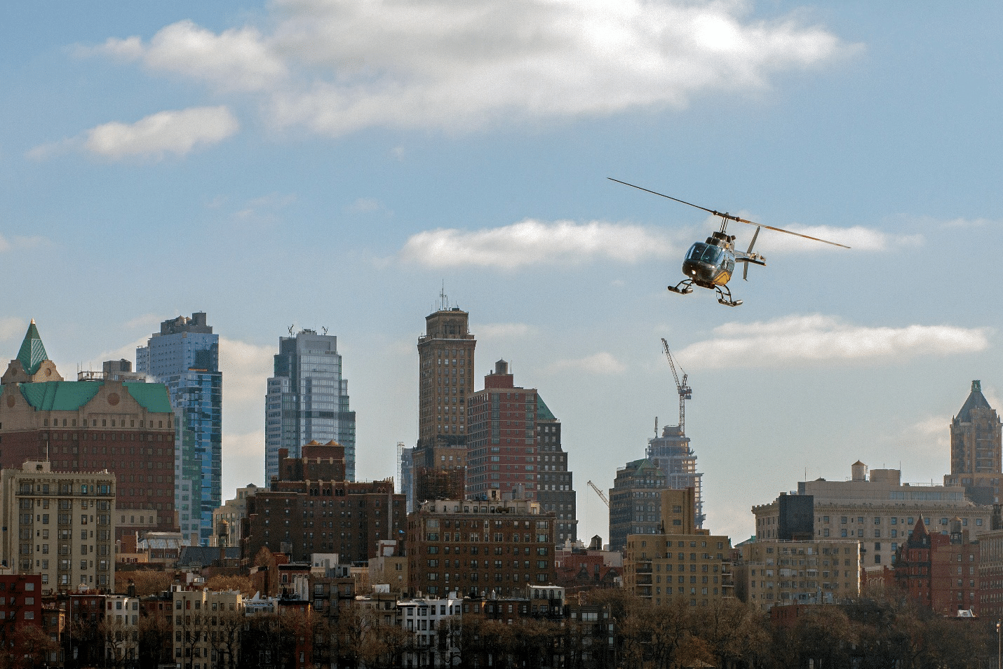 A helicopter flying over buildings