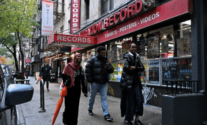 People walking past a record store in NYC