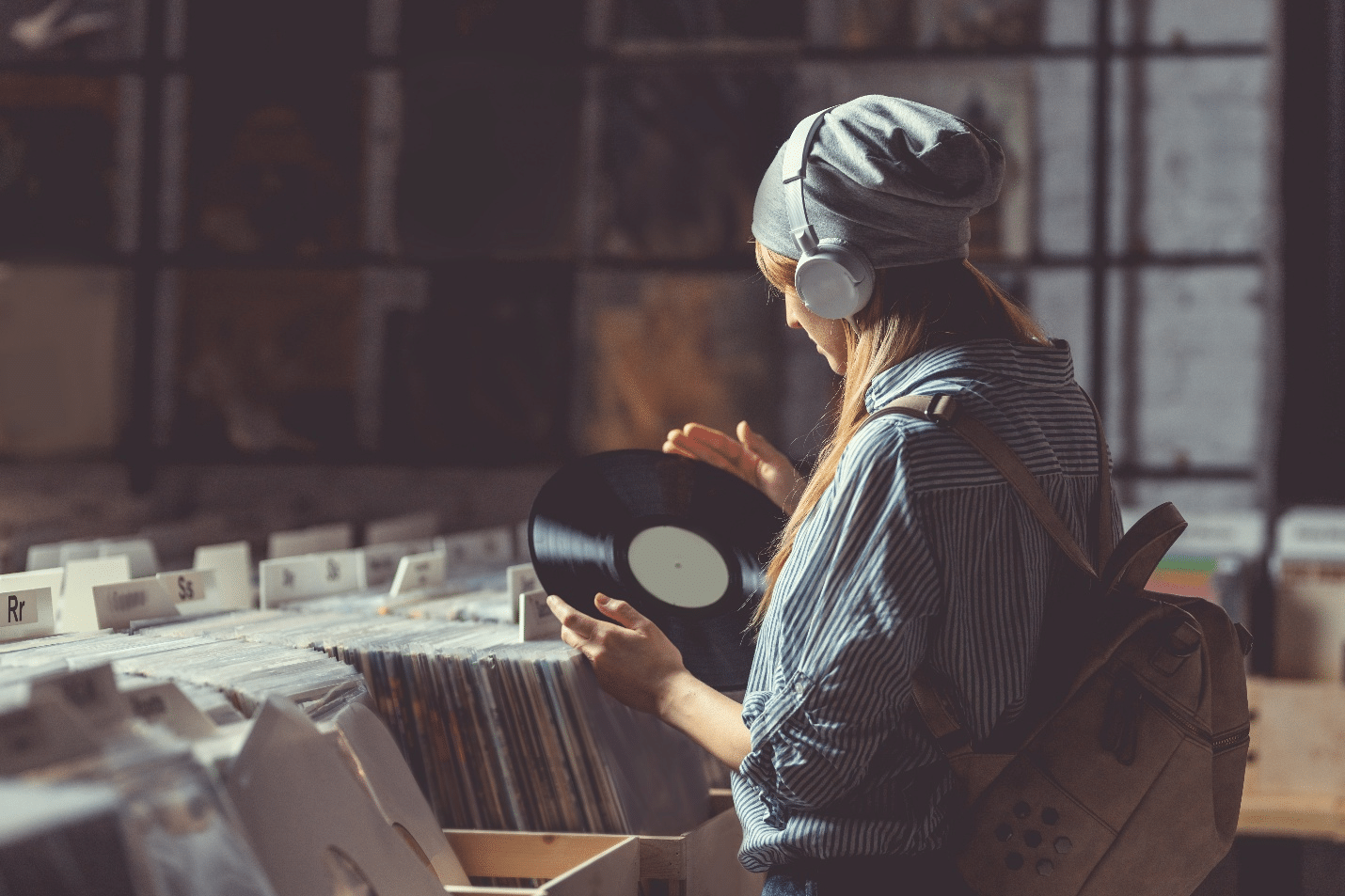 A girl in a vinyl record store