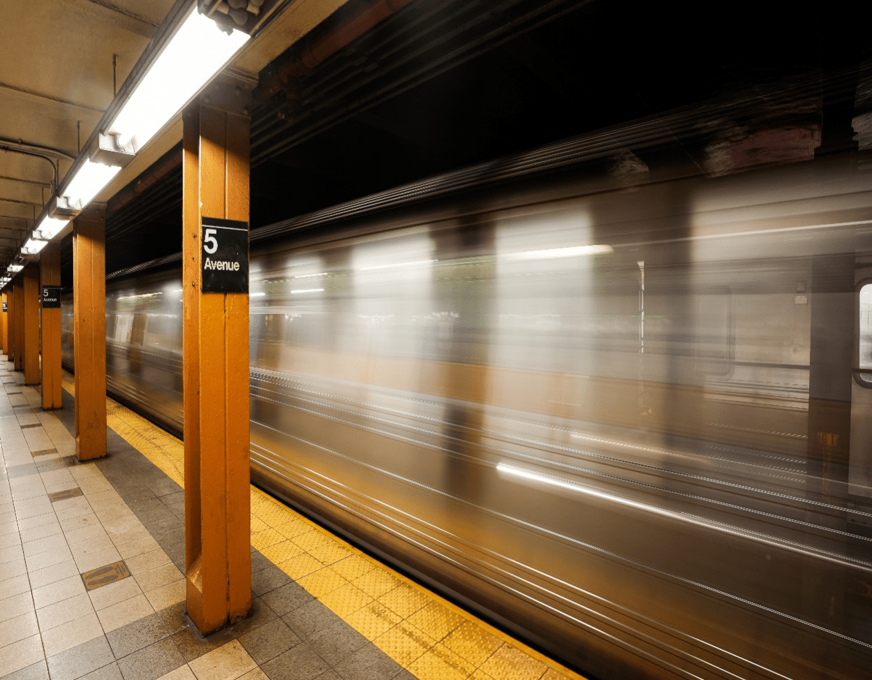 Long exposure of New York City metro subway in motion, symbolizing urban design and transit explored.